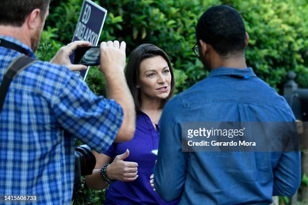 Florida Agriculture Commissioner and Democratic Candidate for Governor Nikki Fried speaks with members of the media during her "Something New" bus...