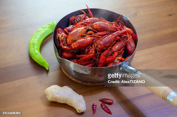 a pot of crayfish on the table - crayfish stock pictures, royalty-free photos & images