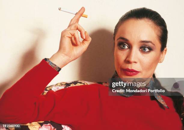 Italian ballet dancer Oriella Dorella smoking a cigarette. 1980s