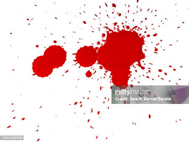 full frame of drops and splashes of red paint on a white canvas. - blood stain stock-fotos und bilder