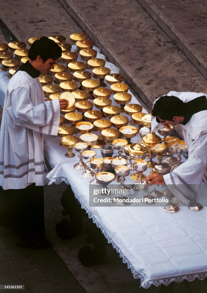 Pyxes Two priests arranging 150 pyxes for the worshippers' communion during ...