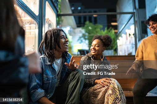 Friends having fun outdoors at night