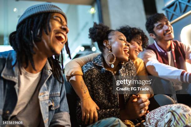 friends having fun outdoors at night - group of friends having fun at night stock pictures, royalty-free photos & images