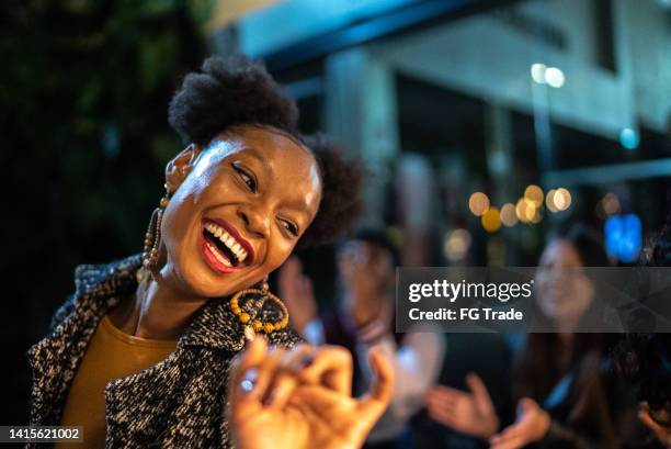 group of friends dancing outside at night - dancing funny carefree woman stock pictures, royalty-free photos & images