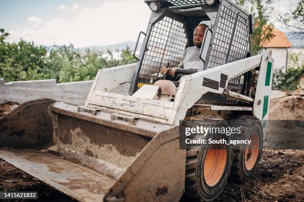Man Using Backhoe 810 Small Backhoe Stock Photos, High-Res Pictures, and Images - Getty ...