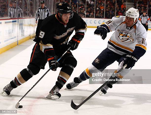 Bobby Ryan of the Anaheim Ducks controls the puck against Brandon Yip of the Nashville Predators during the game on March 18, 2012 at Honda Center in...