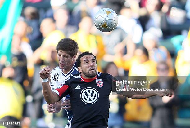 Andrew Boyens of the Los Angeles Galaxy and Dwayne De Rosario of D.C. United vie for a high ball during the MLS match at The Home Depot Center on...