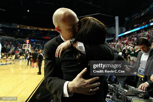 Head coach John Groce of the Ohio Bobcats hugs his wife Allison after defeating the South Florida Bulls during the third round of the 2012 NCAA Men's...