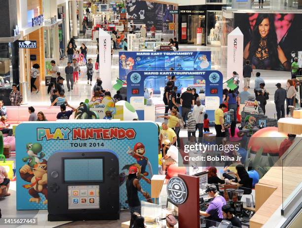 Children and some adults play video games on Nintendo 2DS during the Play Nintendo Tour 2014 inside Westfield Mall, June 6, 2014 in Culver City,...