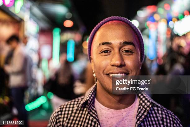 portrait of a young man outdoors at night - alternative lifestyle stock pictures, royalty-free photos & images