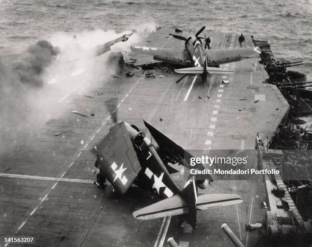 Japanese kamikaze aircraft has just struck the deck of the US aircraft-carrier 'Saratoga' CV-3, flying to Iwo Jima, and has caused a fire. Pacific...