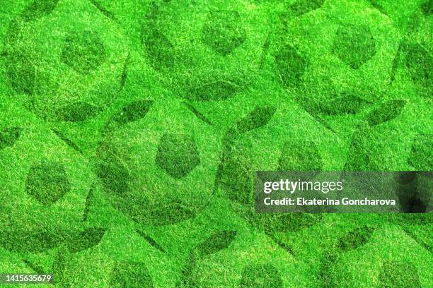 green background with a lot of soccer balls on the grass. - football texture stock pictures, royalty-free photos & images