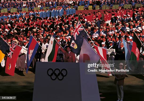 The Japanese gymnast Takashi Ono is reading the Olympic Oath in Tokyo National Olympic Stadium during the opening ceremony of the Olympic Games....