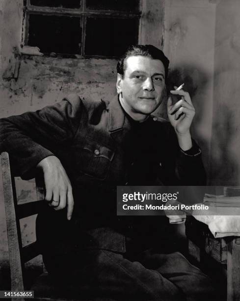 Otto Skorzeny, SS Austrian colonel, is sat down while he is smoking in his detention cell. He is condemned for war crimes; he shall be acquitted of...