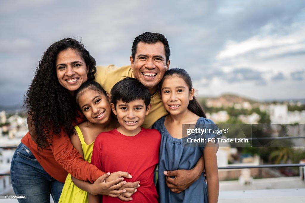 Portrait of Mexican family outdoors