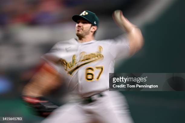 Zach Logue of the Oakland Athletics pitches against the Texas Rangers in the bottom of the second inning at Globe Life Field on August 18, 2022 in...