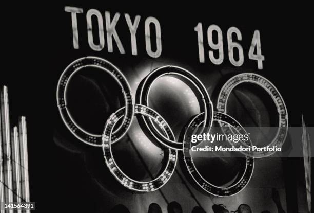 The Tokyo 1964 Olympics neon sign with the five Olympic rings. Japan, October 1964
