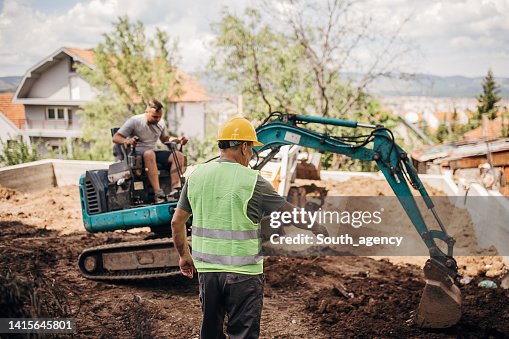 Engineer coordinating work on construction site Engineer coordinating work on construction site