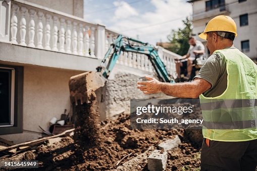 Engineer coordinating work on construction site Engineer coordinating work on construction site