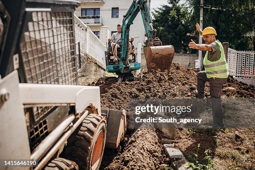 Engineer coordinating work on construction site Engineer coordinating work on construction site