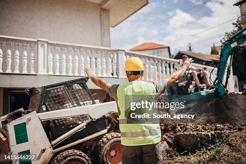 Engineer coordinating work on construction site Engineer coordinating work on construction site