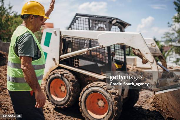 Man Using Backhoe 574 Backhoe Yard Stock Photos, High-Res Pictures, and Images - Getty Images