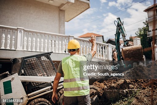 Engineer coordinating work on construction site Engineer coordinating work on construction site