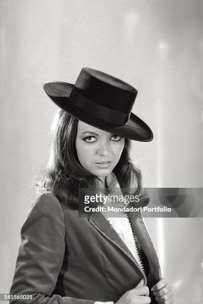 The Italian actress Bedy Moratti posing for a portrait wearing a hat. Italy, 1960s