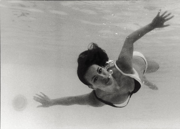 The French actress Claudine Auger is swimming in the water. She is playing in the fourth film of the James Bond saga: 'Thunderball'. She is the Bond...