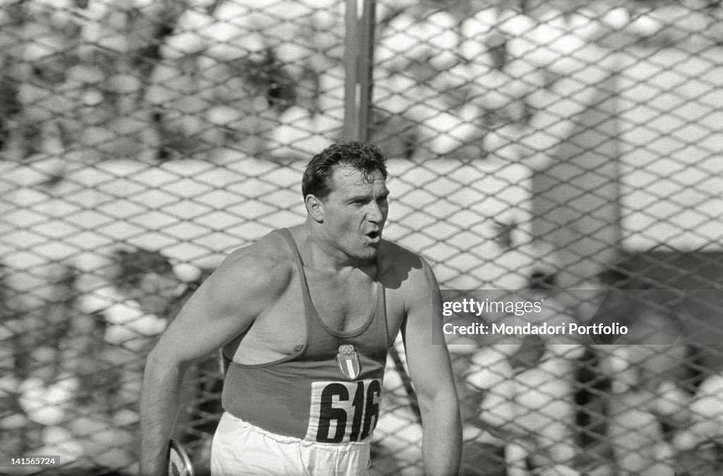 The discus thrower Silvano Meconi photographed inside the 'cage' of ...