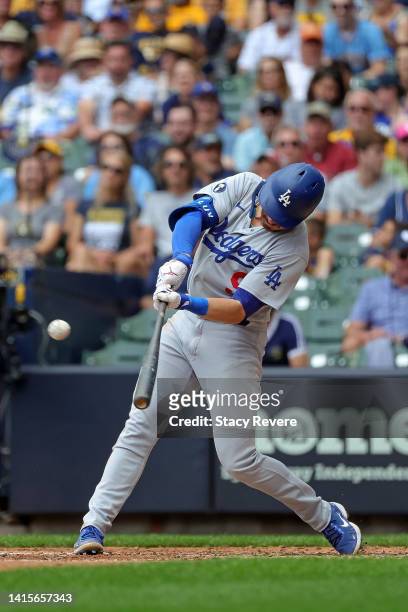 Gavin Lux of the Los Angeles Dodgers hits a two RBI triple against the Milwaukee Brewers during the sixth inning at American Family Field on August...