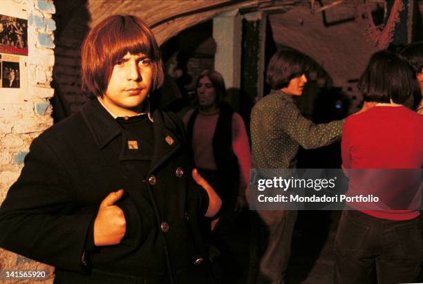 Some young Italian 'beatniks' having fun at the club 'Mondo Beat' in Milan. Milan, 1967