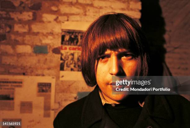 Young Italian 'beatnik' posing at the club 'Mondo Beat' of Milan. Milan, 1967