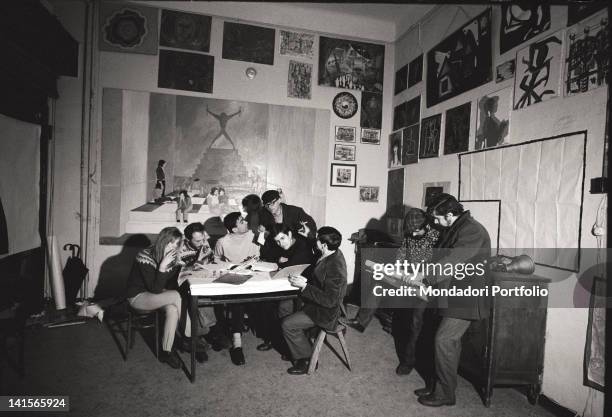 The Italian director Melchiorre Gerbino attending a meeting of 'Mondo Beat' magazine. Milan, 1960s