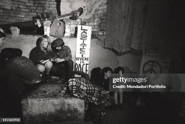 Italian beatniks having a rest at Mondo Beat club in Milan. Milan, 1960s