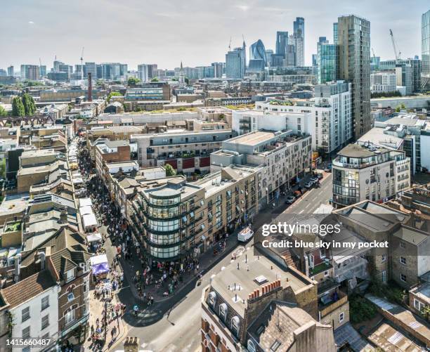 london - brick lane, the famous street in the east of london from a drone perspective - brick lane stockfoto's en -beelden