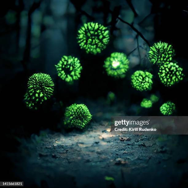 a digitally rendered image of virus cells flying in the forest at night - arenavirus stock pictures, royalty-free photos & images