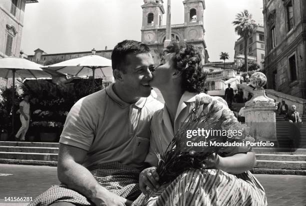 Czechoslovak athlete Olga Fikotova kissing her husband, American athlete Harold Connolly at the Rome Olympic Games. Rome, August 1960