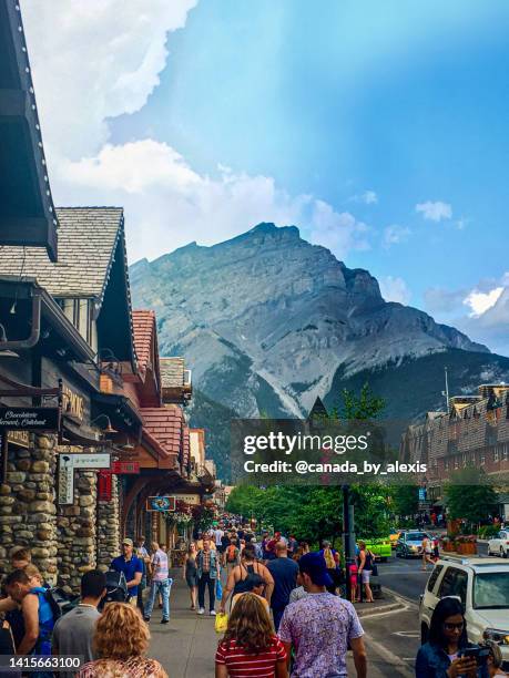 tourists' overrun town of banff - banff springs hotel stock pictures, royalty-free photos & images