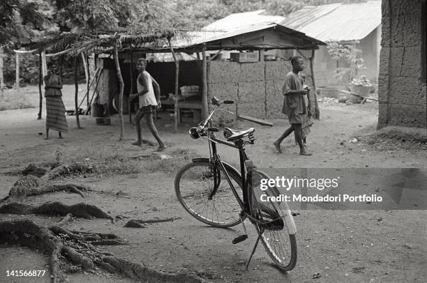 Bicycle parked in the middle of the street in a Nigerian village. Nigeria