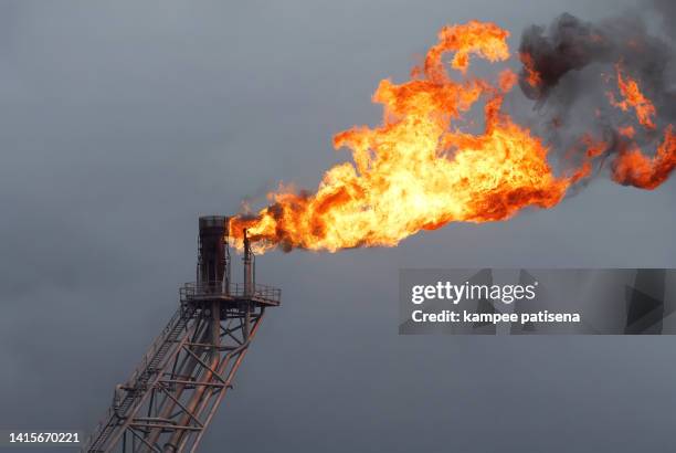 gas flare at petroleum and natural gas power plant - oil rig fire stock pictures, royalty-free photos & images