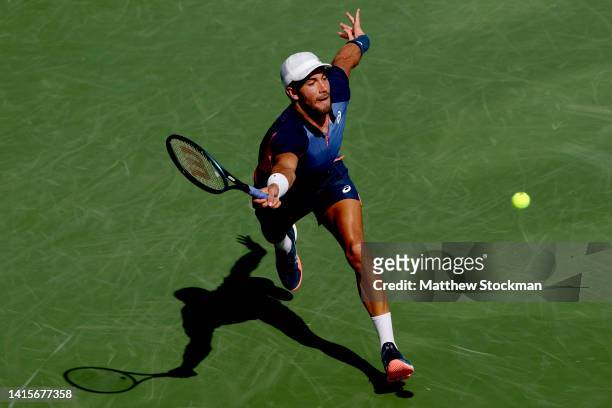 Borna Coric of Croatia lunges for a ball while playing Roberto Bautista Agut of Spain during the Western & Southern Open at Lindner Family Tennis...