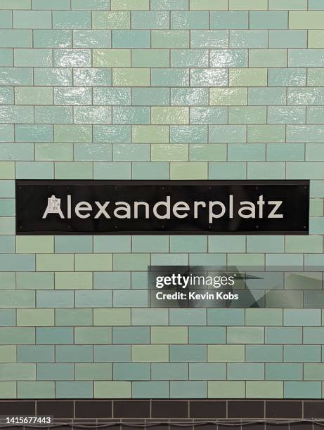 subway sign of the u bahn station "alexanderplatz" in berlin, germany. - berlin subway stock pictures, royalty-free photos & images