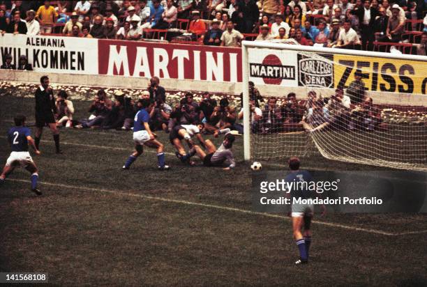 The German striker Gerd Muller is about to score the first goal in the semi final of the World Cup Championship, played between Italy and West...