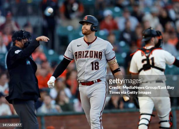 Arizona Diamondbacks Carson Kelly reacts after striking out with bases loaded against San Francisco Giants starting pitcher Alex Cobb in the first...