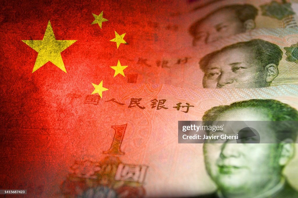 Chinese yuan cash bills and chinese flag