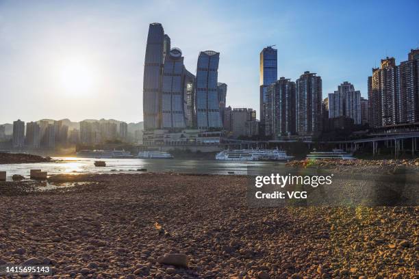 The Jialing River bed at the confluence with the Yangtze River is exposed due to drought on August 18, 2022 in Chongqing, China. The water level of...