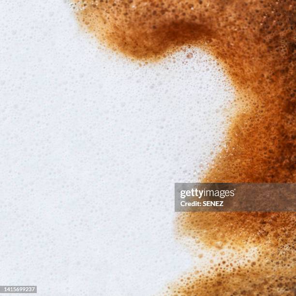 full frame of a cup of freshly made coffee with milk, backgrounds - foam material stockfoto's en -beelden