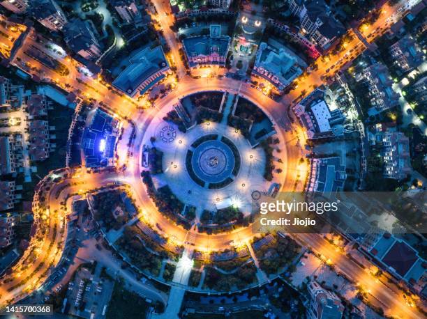 traffic circle at night - road directly above stock pictures, royalty-free photos & images
