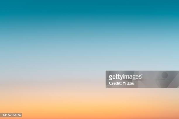 gradual color of the sky at sunset - orange colour fotografías e imágenes de stock